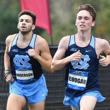 two athletes competing in a race wearing athletic uniforms two athletes competing in a race wearing athletic uniforms