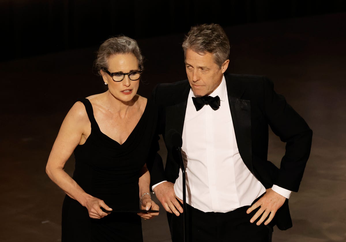 Hugh Grant's Awkward Oscars Interview With Ashley Graham Gets Backlash