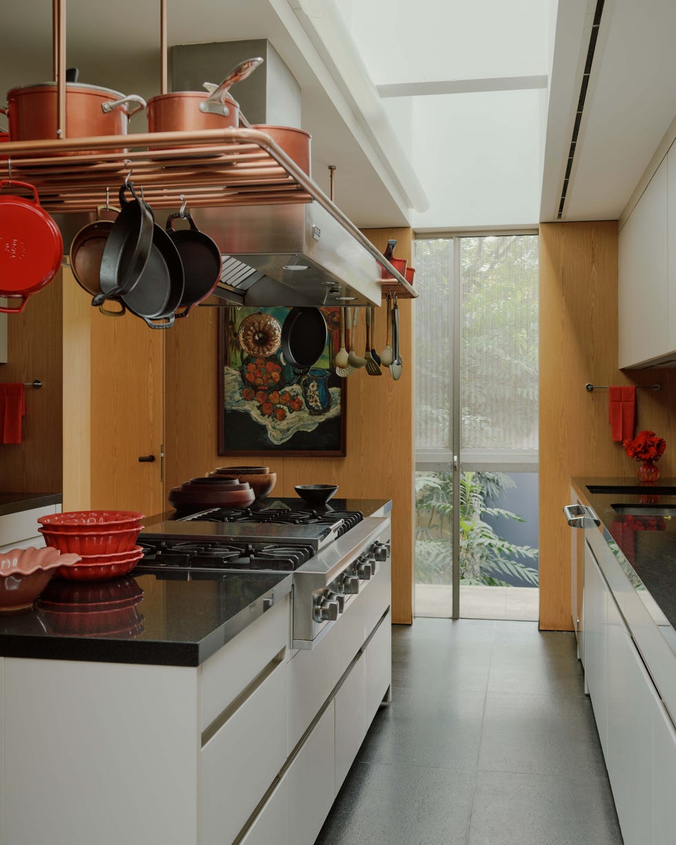 a kitchen with a stove and pans