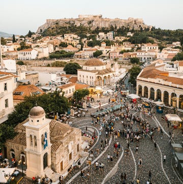 a city with many buildings and people a city with many buildings and people