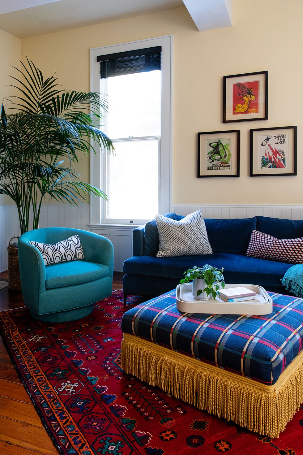 a living room with blue couches