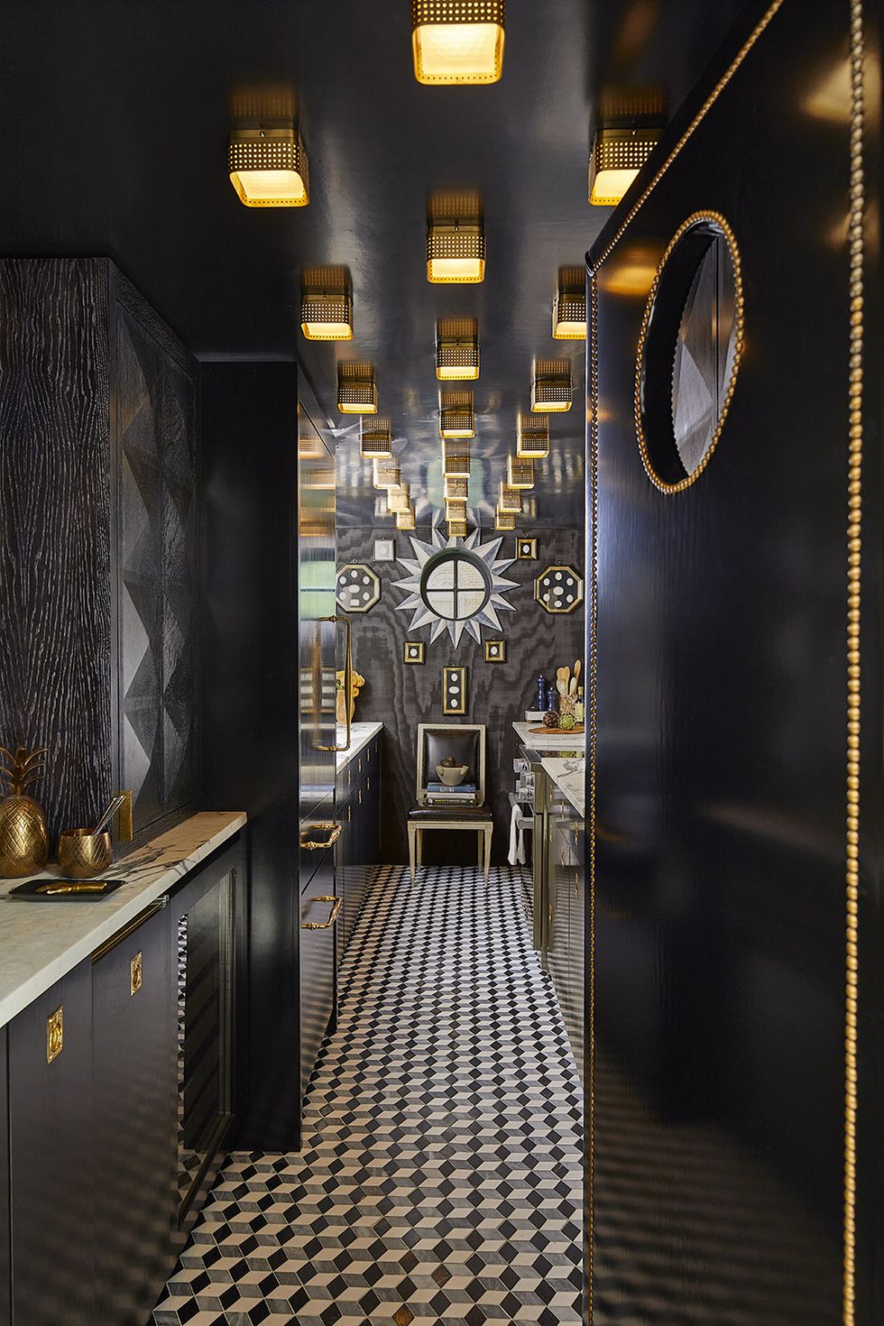 black cabinets, white, black and gray tiles, gold hardware