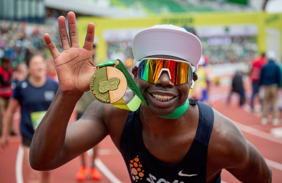 finisher holding medal at the eugene marathon