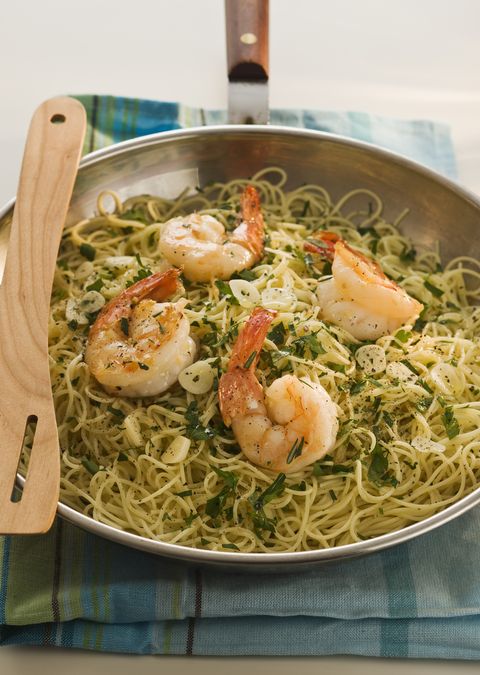 angel hair pasta with shrimp and rosemary in pan, studio shot