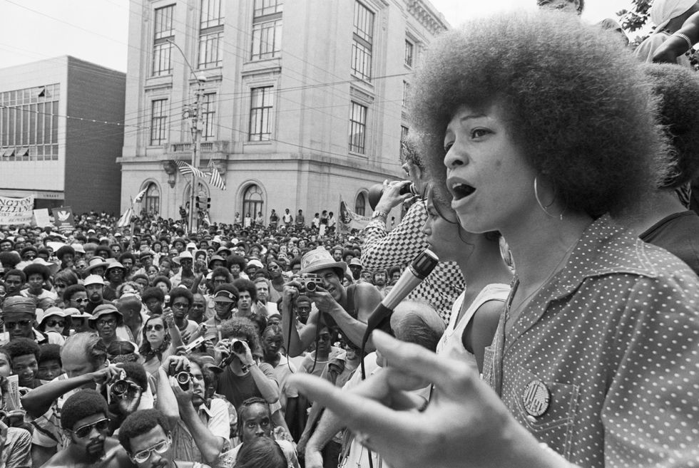 angela davis speaks at a street rally in raleigh