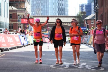 group of participants celebrating at a marathon finish line
