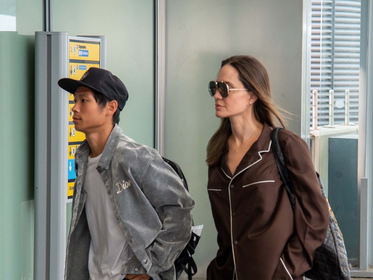 Angelina Jolie Wears Brown Silk Pajamas at London Airport