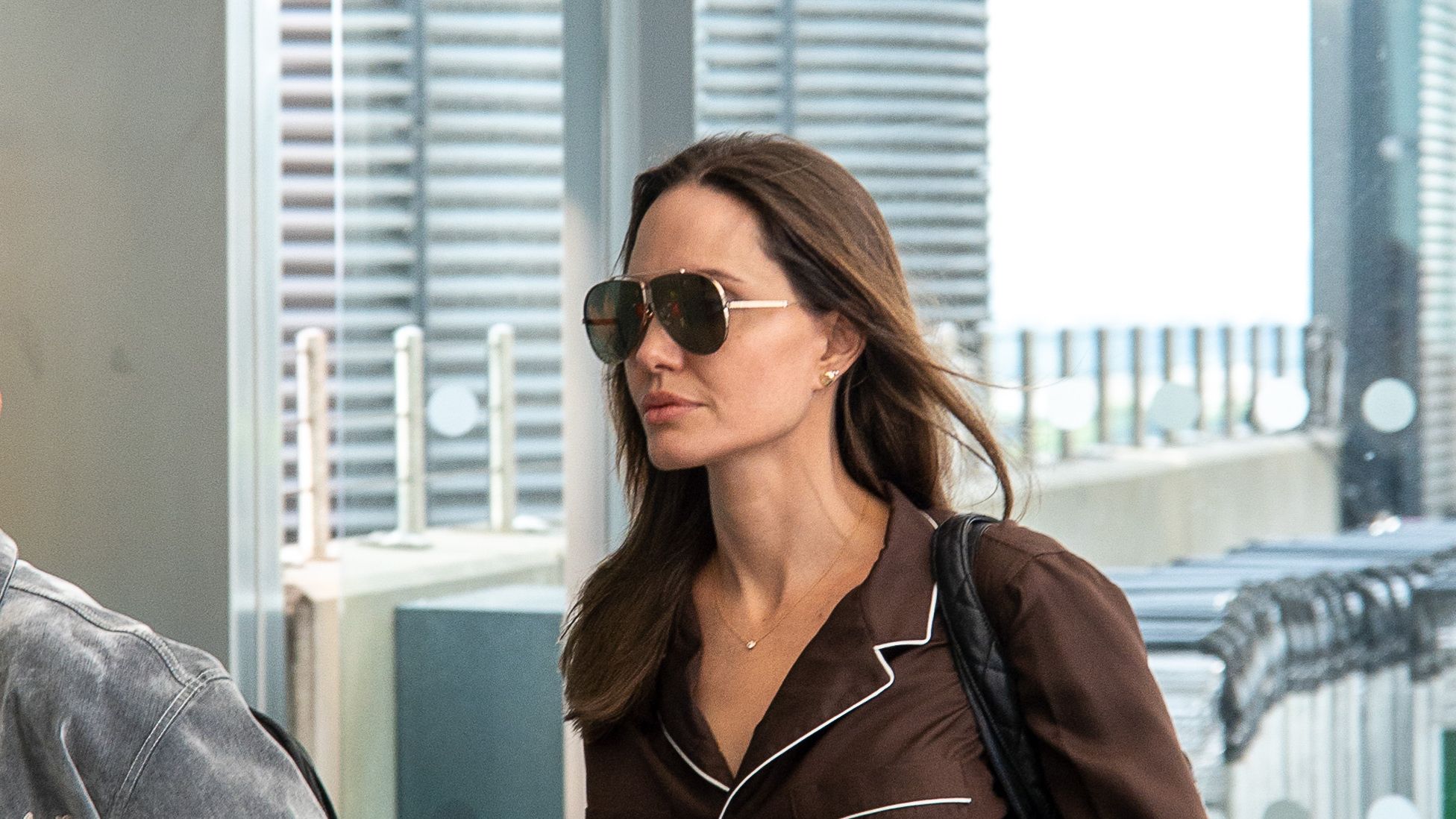Actress Angelina Jolie walks with a Louis Vuitton bag in the