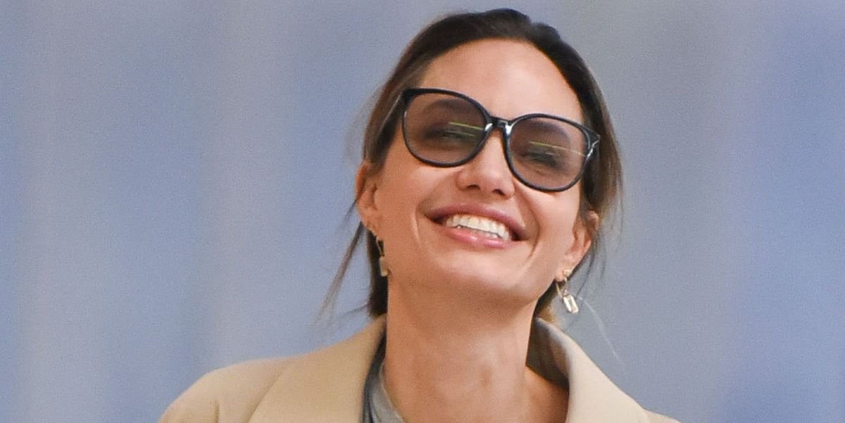 Angelina Jolie Expertly Pairs Her Beige Trench Coat With Breezy Gray Trousers