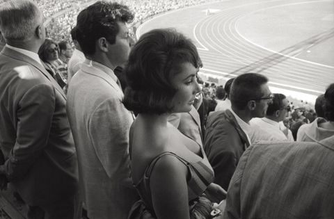 liz taylor and eddie fisher at the opening ceremony of the olympic games
