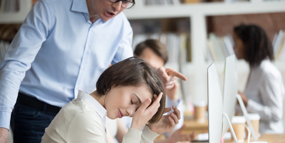 angry irritated company ceo reprimanding employee female