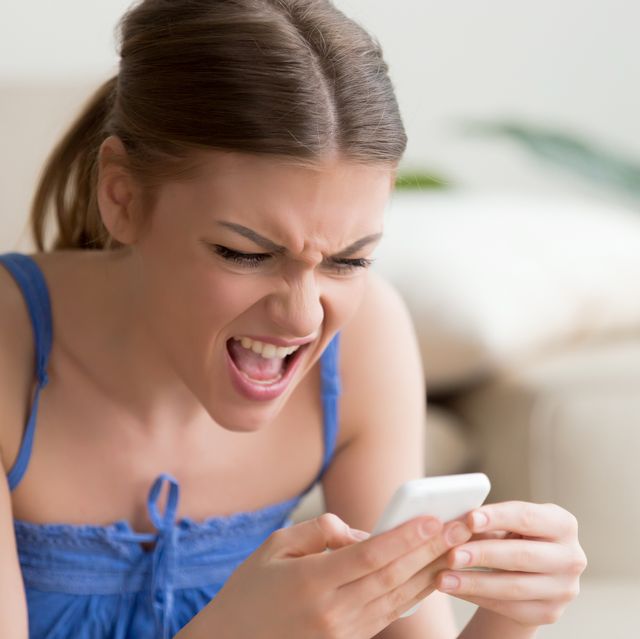 Angry woman annoyed by not working smartphone, problem with mobile