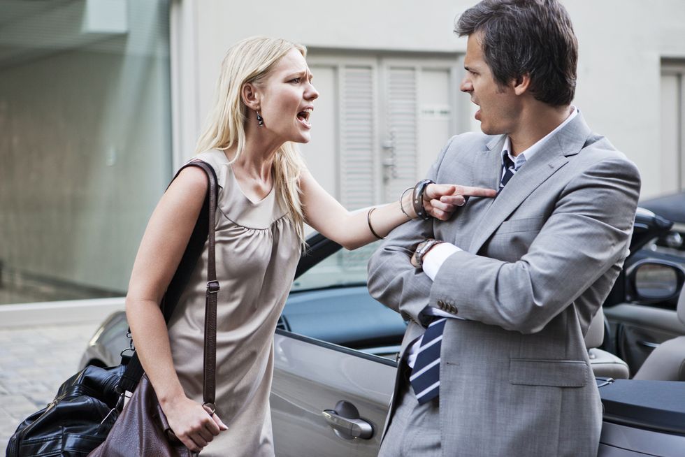 angry woman shouting at man whist having argument