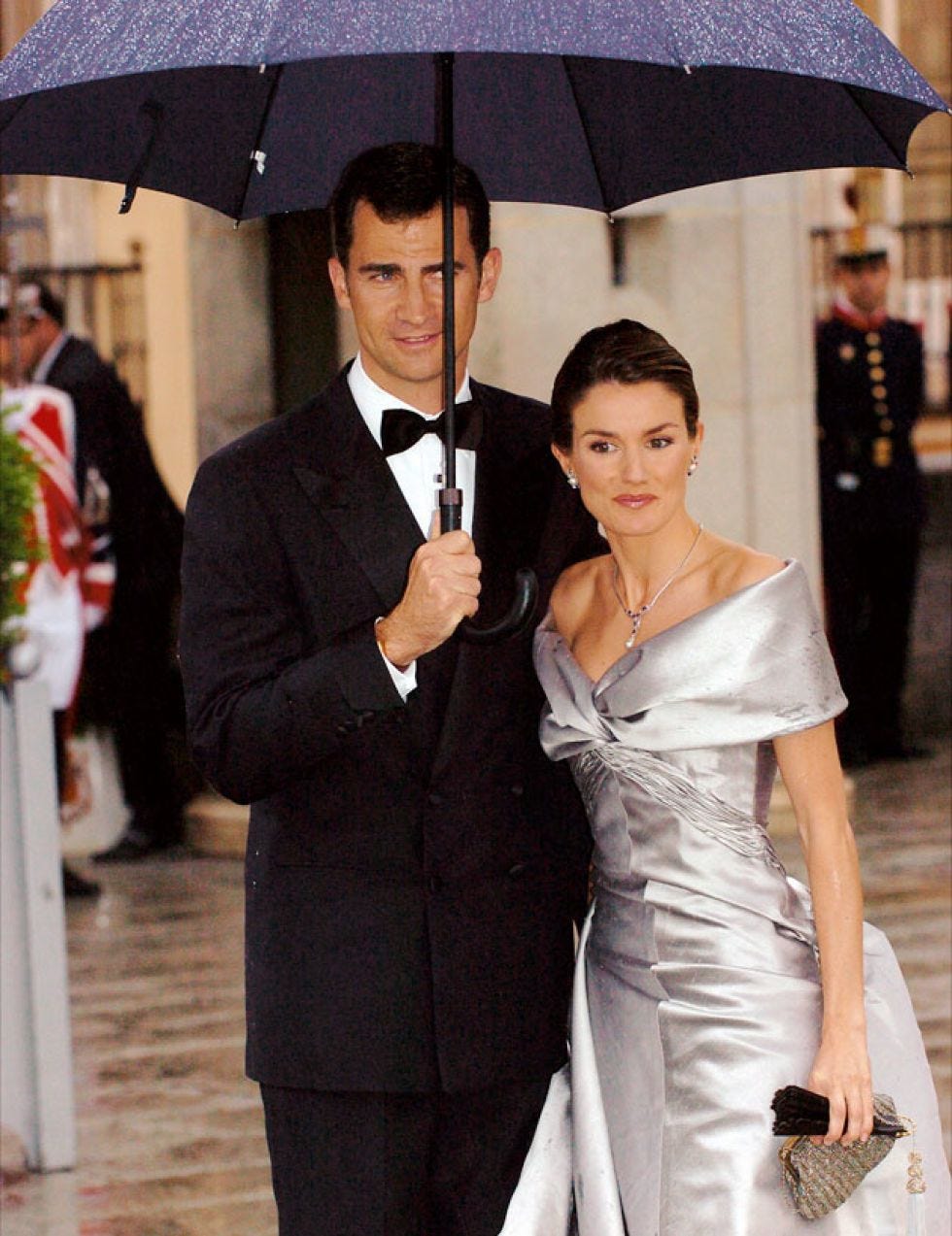 Umbrella, Facial expression, Formal wear, Fashion, Suit, Event, Dress, Ceremony, Bride, Gown, 