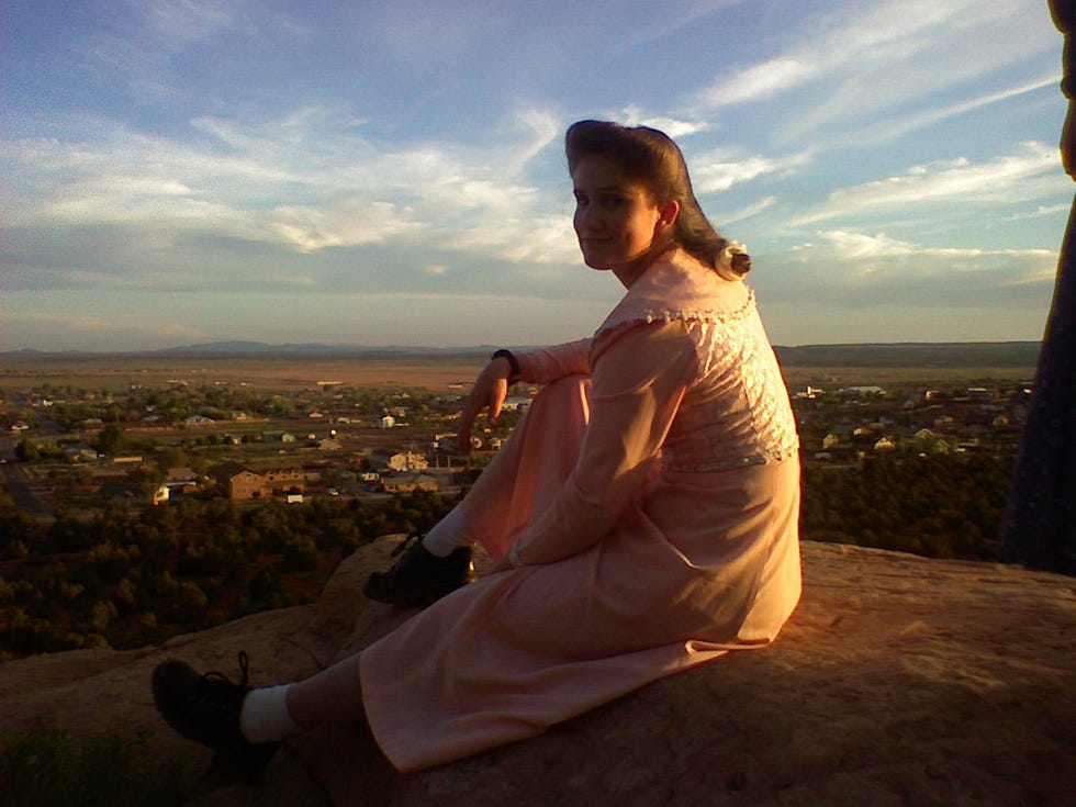 a man sitting on a rock