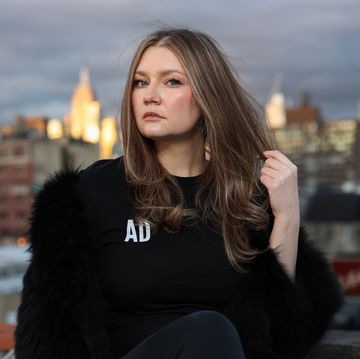 anna delvey poses for a portrait in her home