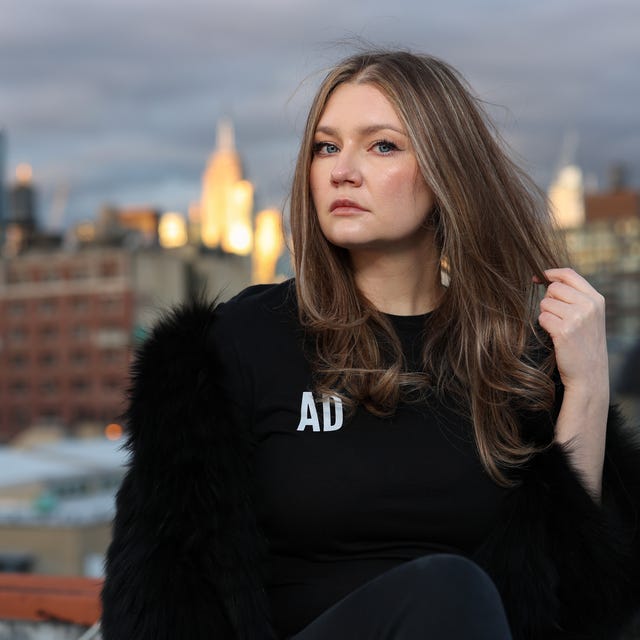 anna delvey poses for a portrait in her home