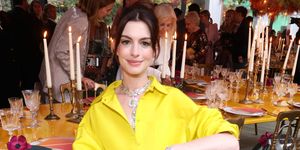 anne hathaway in a yellow outfit
