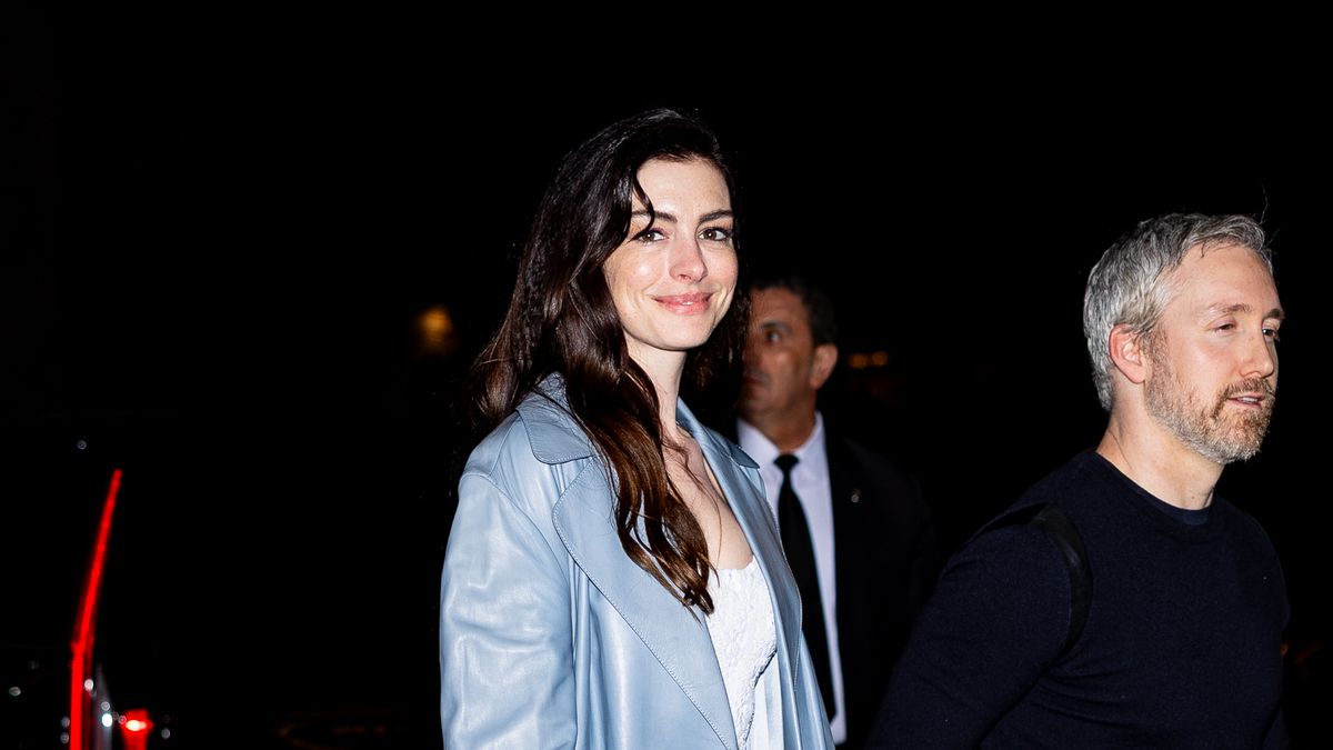 preview for Anne Hathaway stuns in white safety pin dress at the 2023 Met Gala