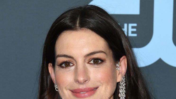 Anne Hathaway wears gold gown on trip to Venice