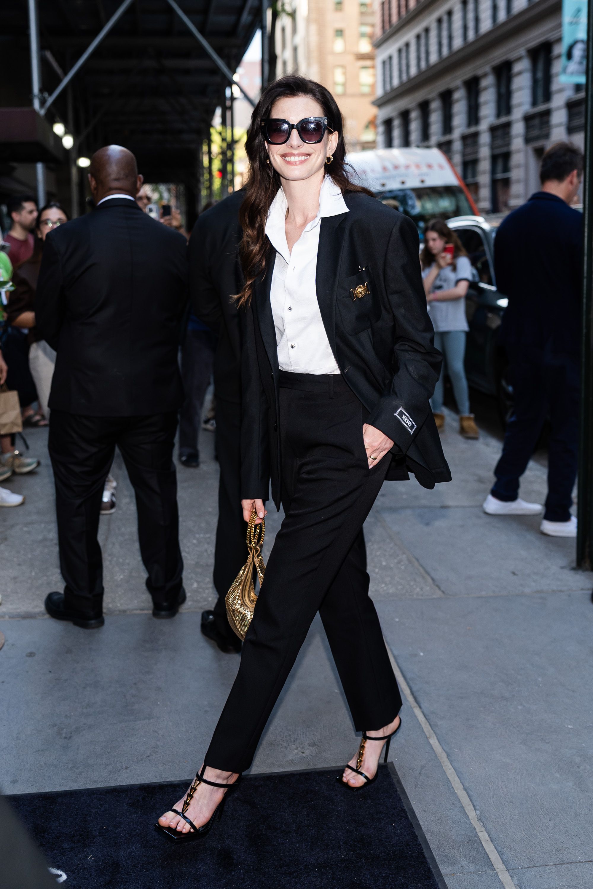 Anne Hathaway Suits up in Versace and Packs a Serious Punch