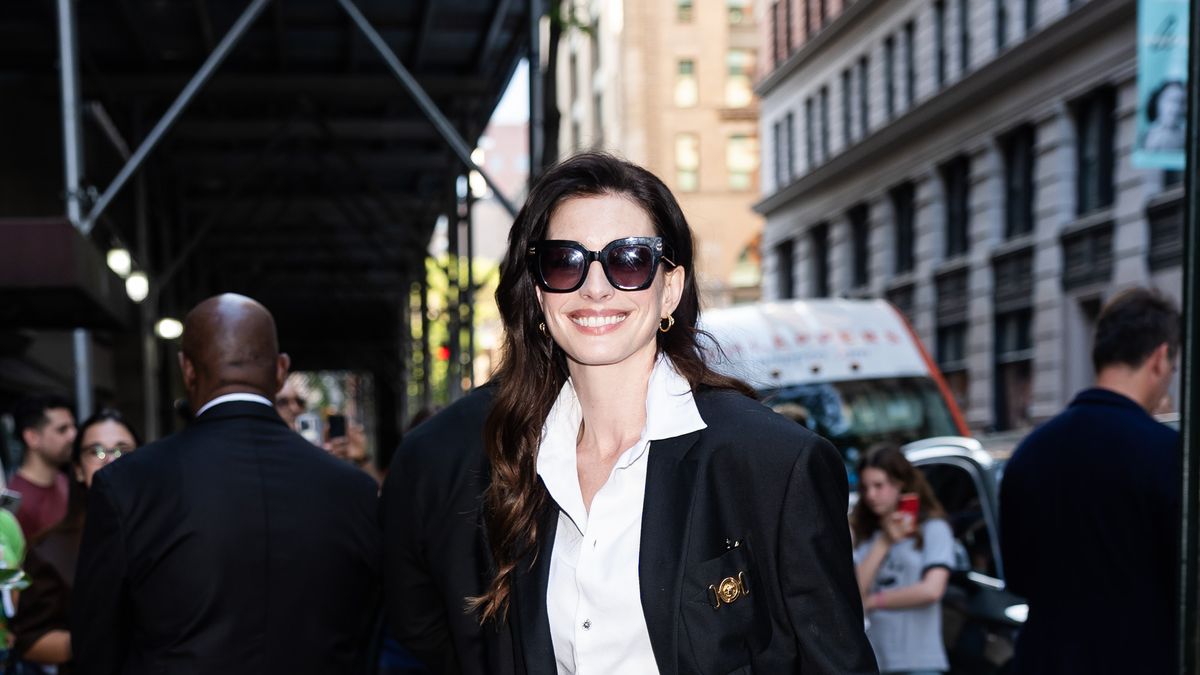 preview for Anne Hathaway stuns in white safety pin dress at the 2023 Met Gala