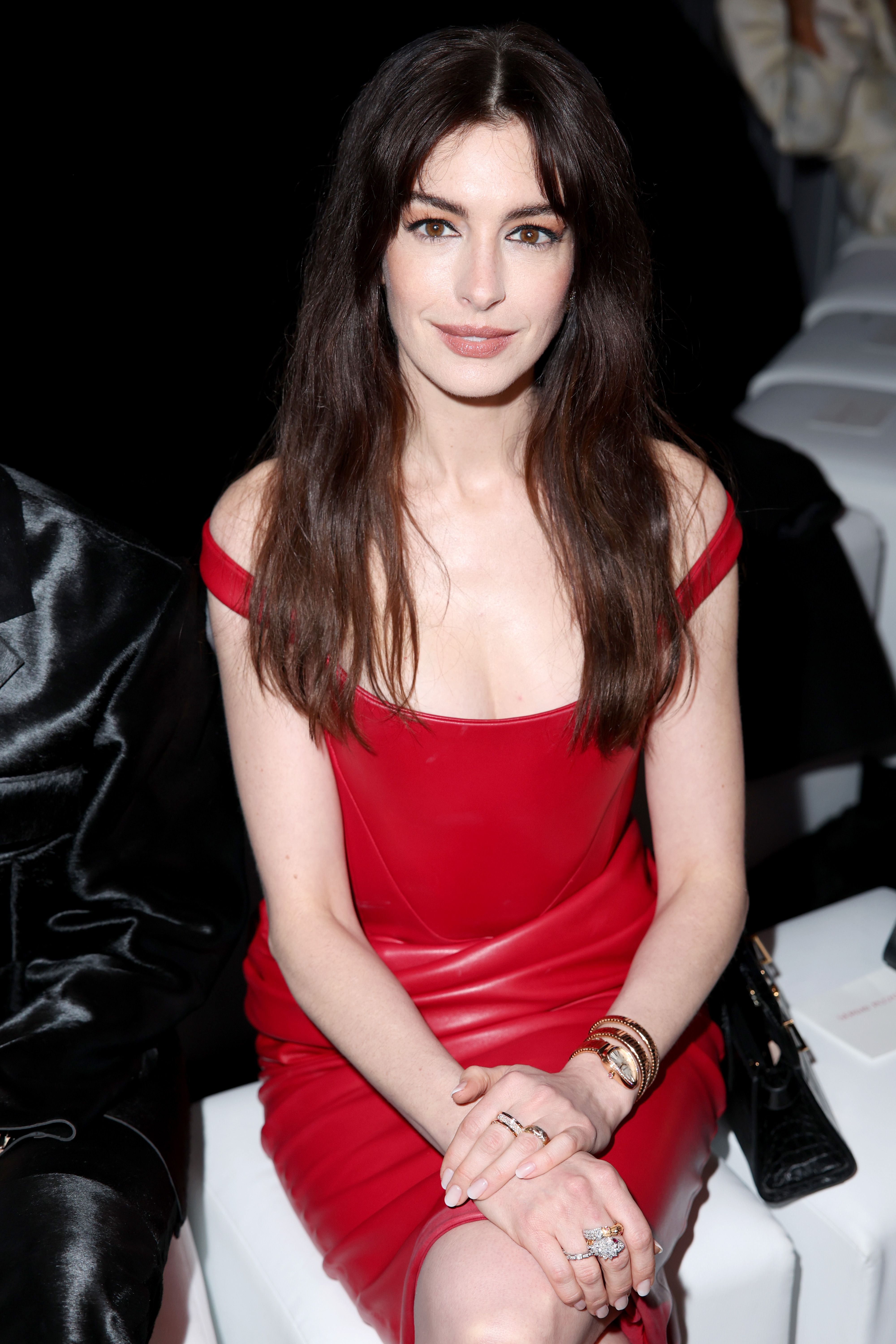 Anne Hathaway Wears Hot Red PVC Dress to the Versace Show