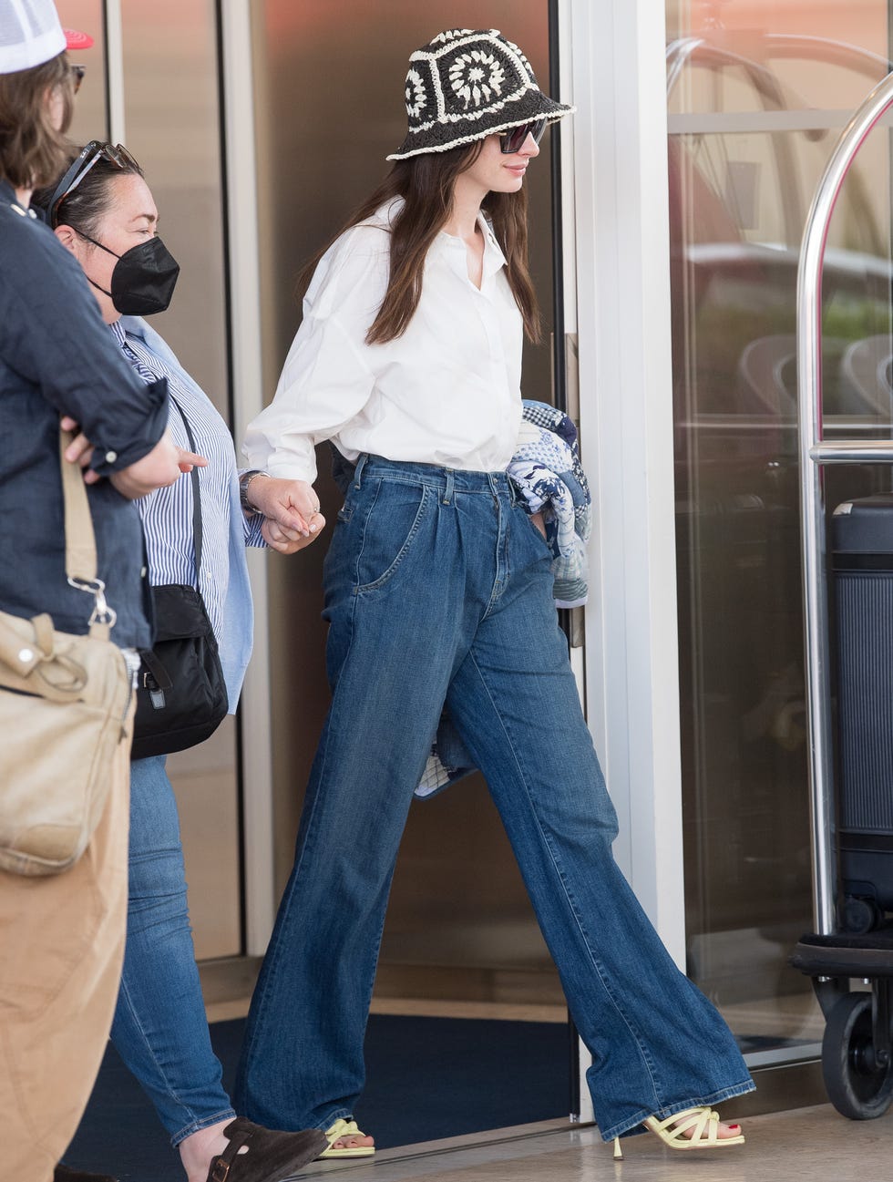 Anne Hathaway Wore Flattering Wide-Leg Jeans in Paris