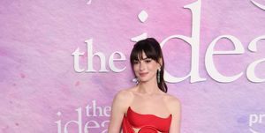 anne hathaway wears a custom made versace gown for the premiere of the idea of you the dress features a cut out corset bodice