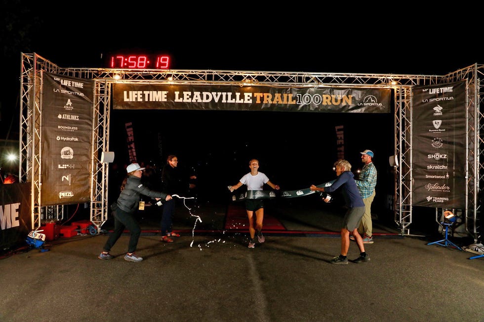 participants celebrate finishing the leadville trail 100 run as they cross the finish line