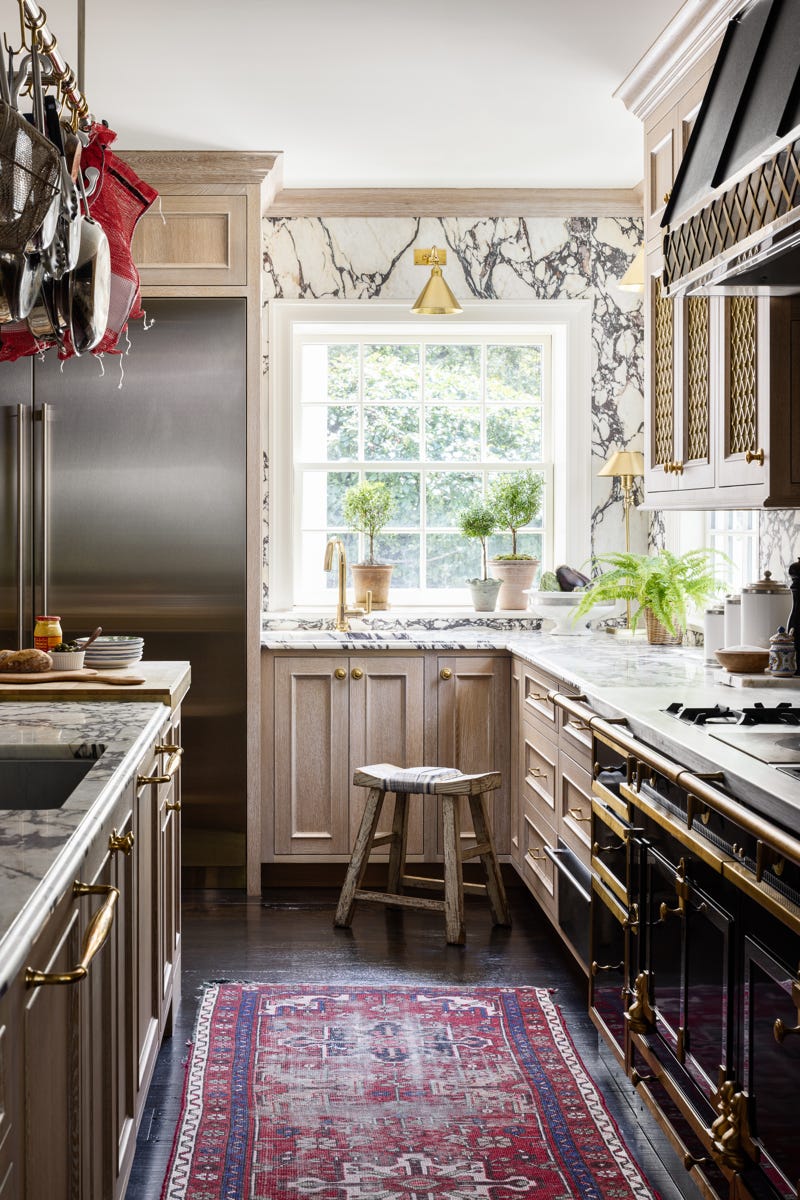 a kitchen with a rug and a rug