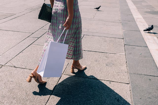 anonymous businesswoman walking on the street after work