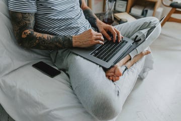 negative effects of sitting, man works from home sitting on couch