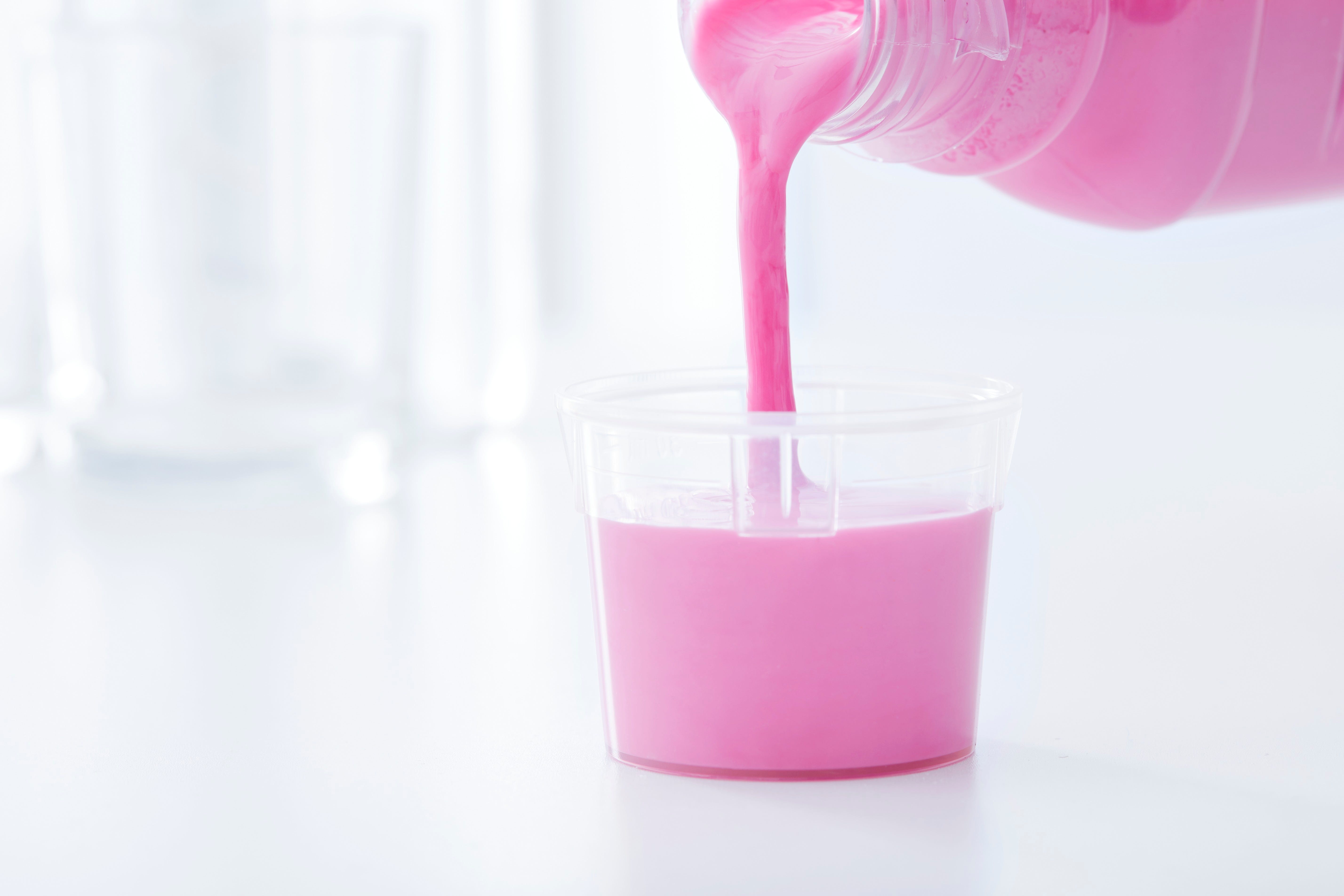 antacid medicine in dosing cup