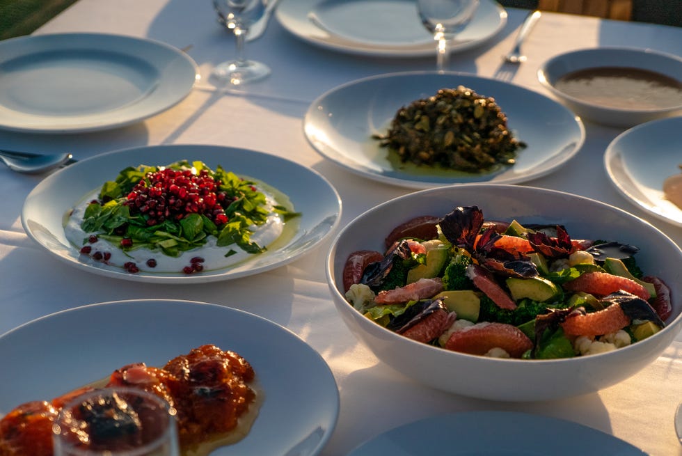 a table full of plates of food