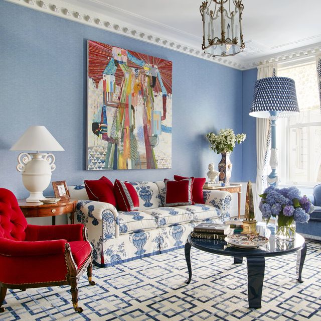 equally ample upholstered furnishings are clad in arresting colors and patterns including cherry red velvet and the sofas blockprinted linen while plaster and marble objects echo the color and classical tone of the original ceiling moldings
the medallion border on the drapes was inspired by one in a christian lacroix showroom