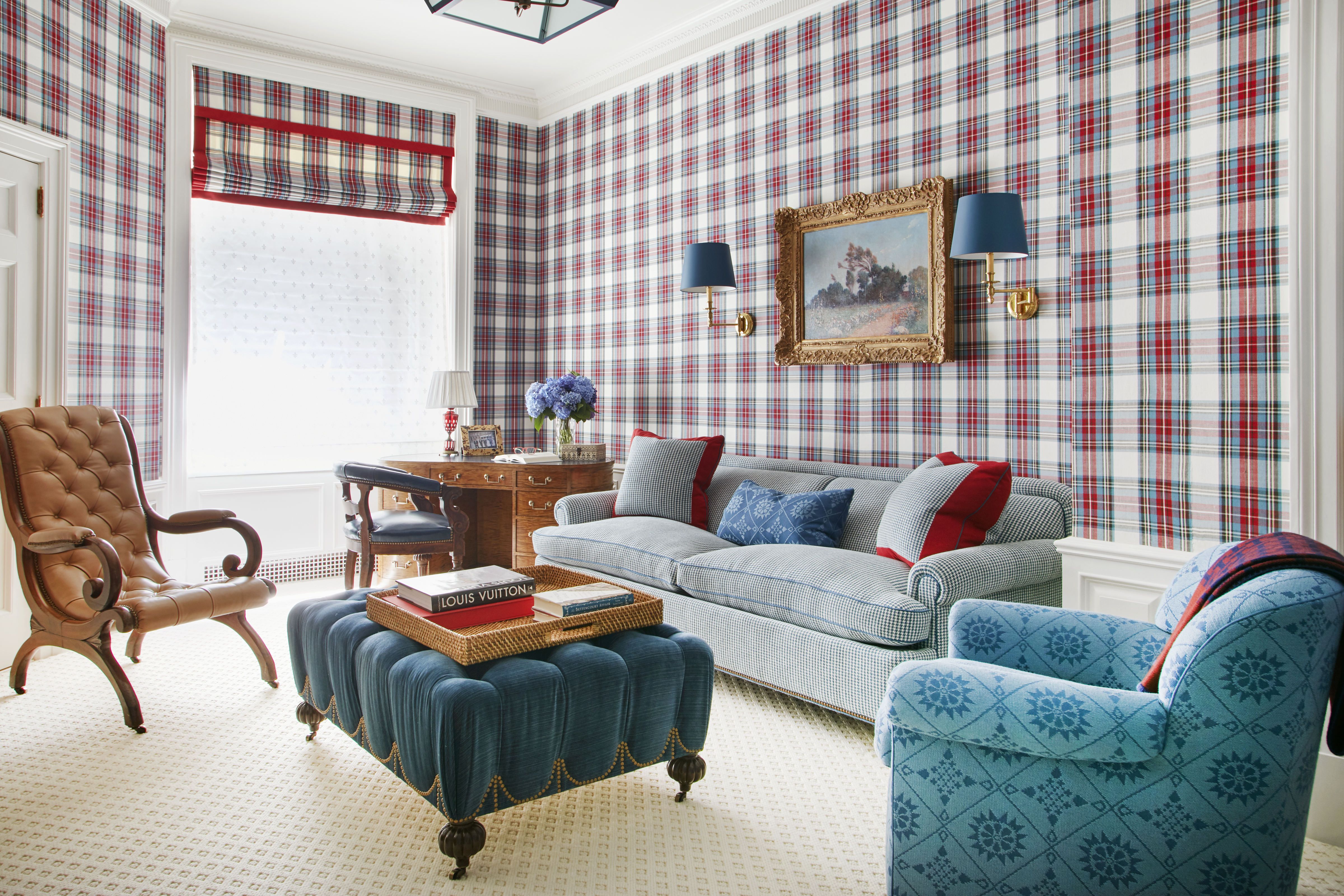 a beaming desk is dressed in a lee jofa tartan pattern recolored especially for this room and the armchair upholstery is inspired by an antique american weave and the leather chair is antique english