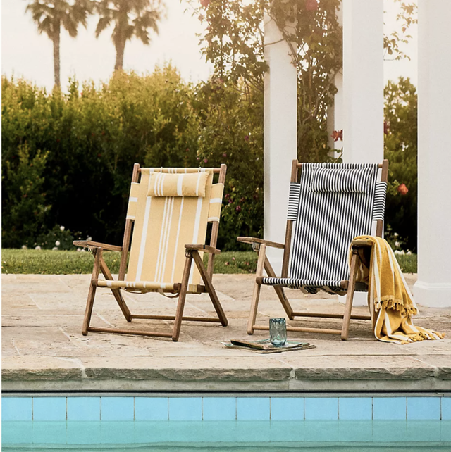 a set of two outdoor chairs by a pool