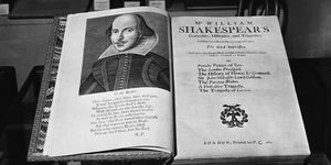 a book opened to its title page that includes a drawn portrait of william shakespeare on the left side and additional details about the book, including its name, on the right side
