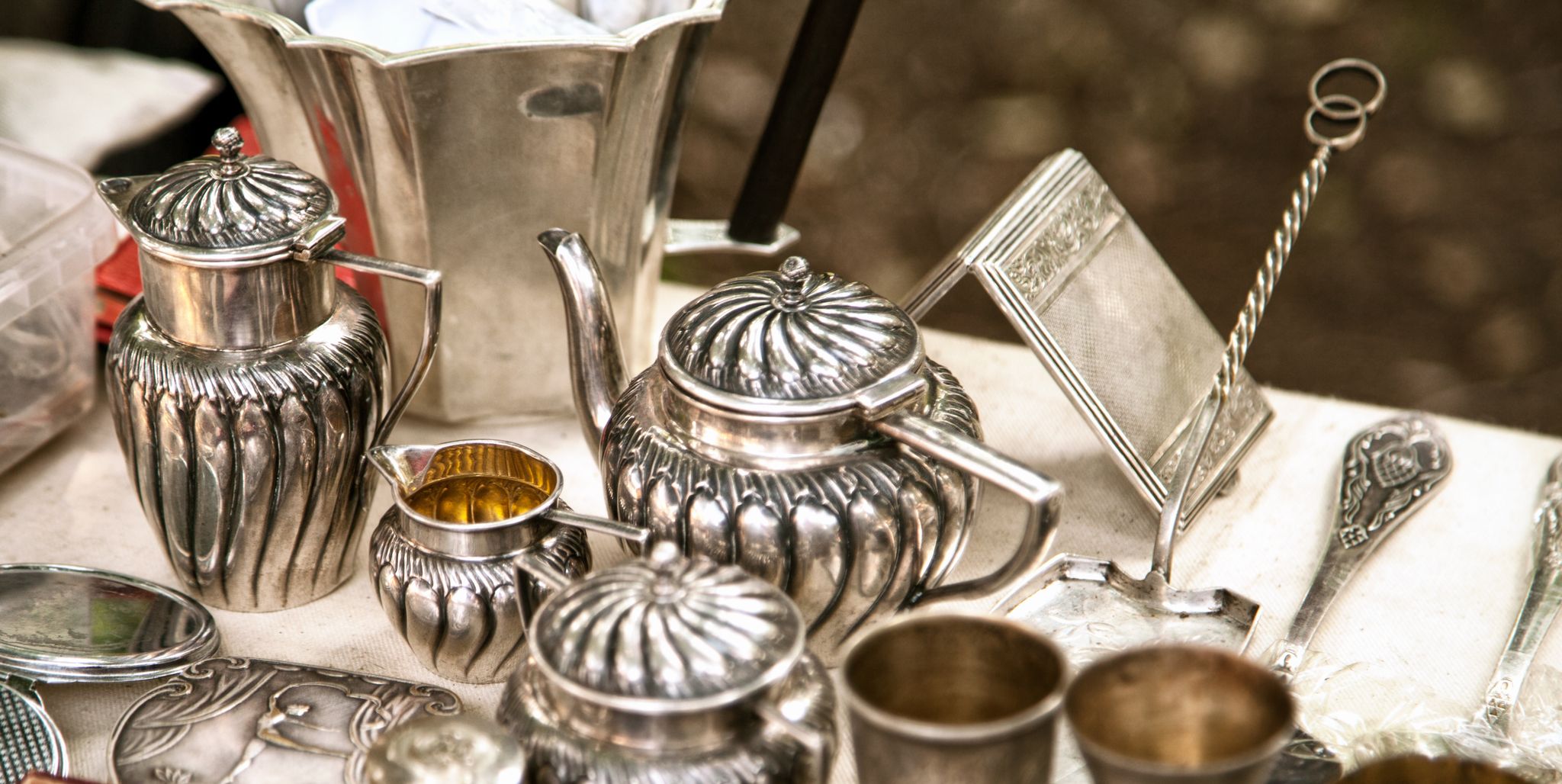 https://hips.hearstapps.com/hmg-prod/images/antique-silver-teapots-creamer-and-other-utensils-royalty-free-image-1704405445.jpg?crop=1.00xw:0.753xh;0,0.179xh&resize=2048:*