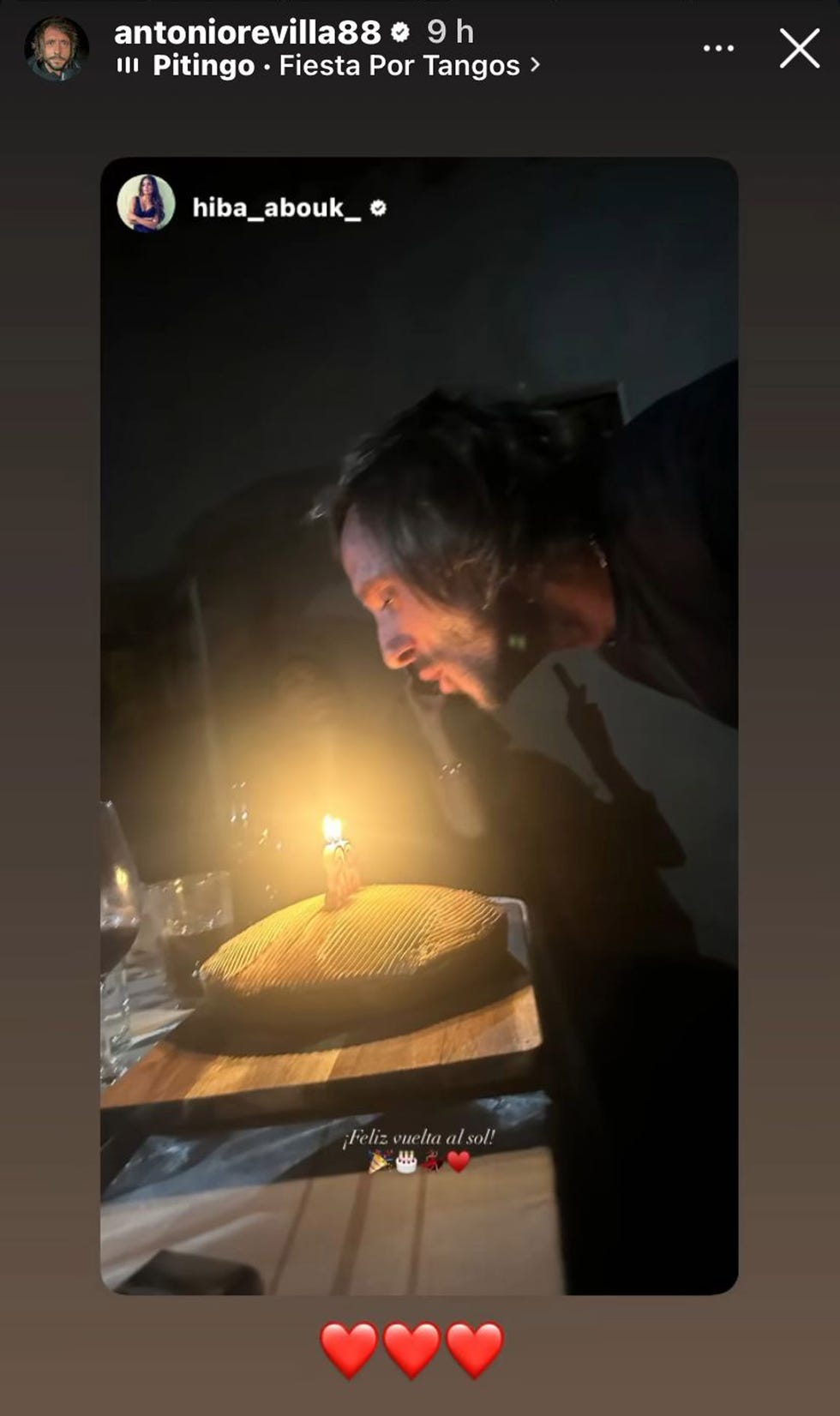 a birthday celebration with a cake and candle