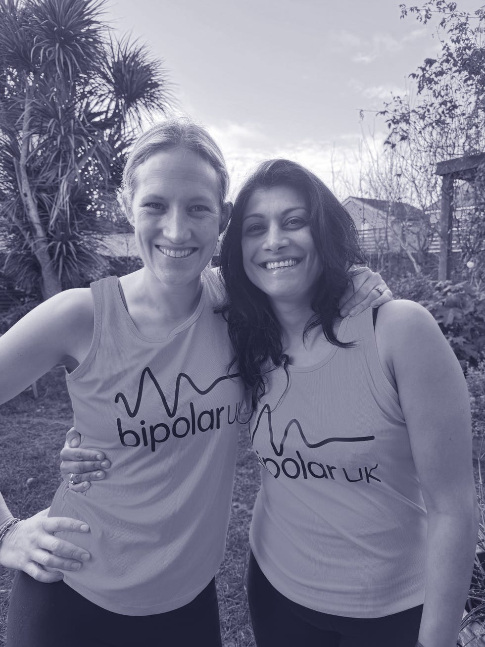 two individuals posing together in tshirts showcasing bipolar uk branding