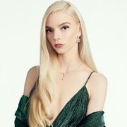 anya taylor joy in green dress against white background