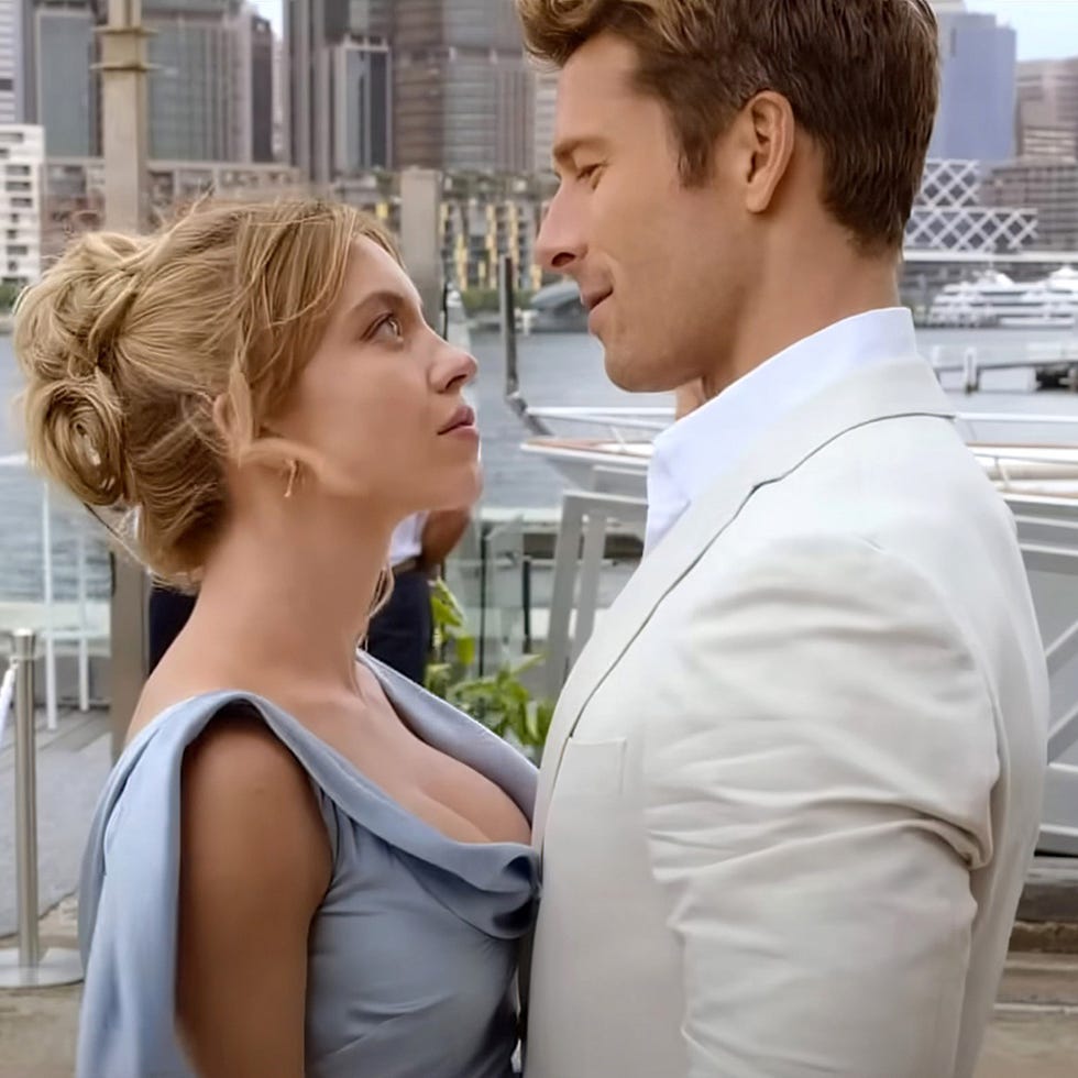 a couple is standing closely together, gazing at each other a couple is standing closely together, gazing at each other