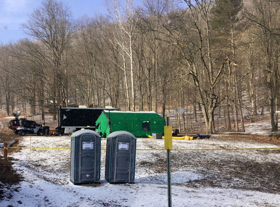 in this march 13, 2018 photo, fbi agents and representatives of the pennsylvania department of conservation and natural resources set up a base off route 555 in benezette township, elk county, pa, at a site where treasure hunters say civil war era gold is buried katie weidenboernerthe courier express via ap