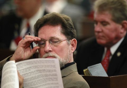 rep larry g pittman reads documents during  house session in raleigh, nc, wednesday, jan 30, 2013 ap photothe news  observer, takaaki iwabu