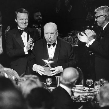 american film institute award and producer director alfred hitchcock, center, stands to receive the applause of producer george stevens jr, left, and actor cary grant at the institute’s testimonial dinner in beverly hills on wednesday, march 8, 1979 hitchcock received the seventh annual life achievement award in a 90 minute tribute to the veteran film maker ap photohuynh