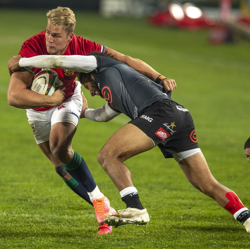 british and irish lions duhan van der merwe, left, is challenged by south african sharks jaden hendrikse during a warm up rugby match between south africas sharks and british and irish lions at ellis park stadium in johannesburg, south africa, wednesday, july 7, 2021 ap photothemba hadebe