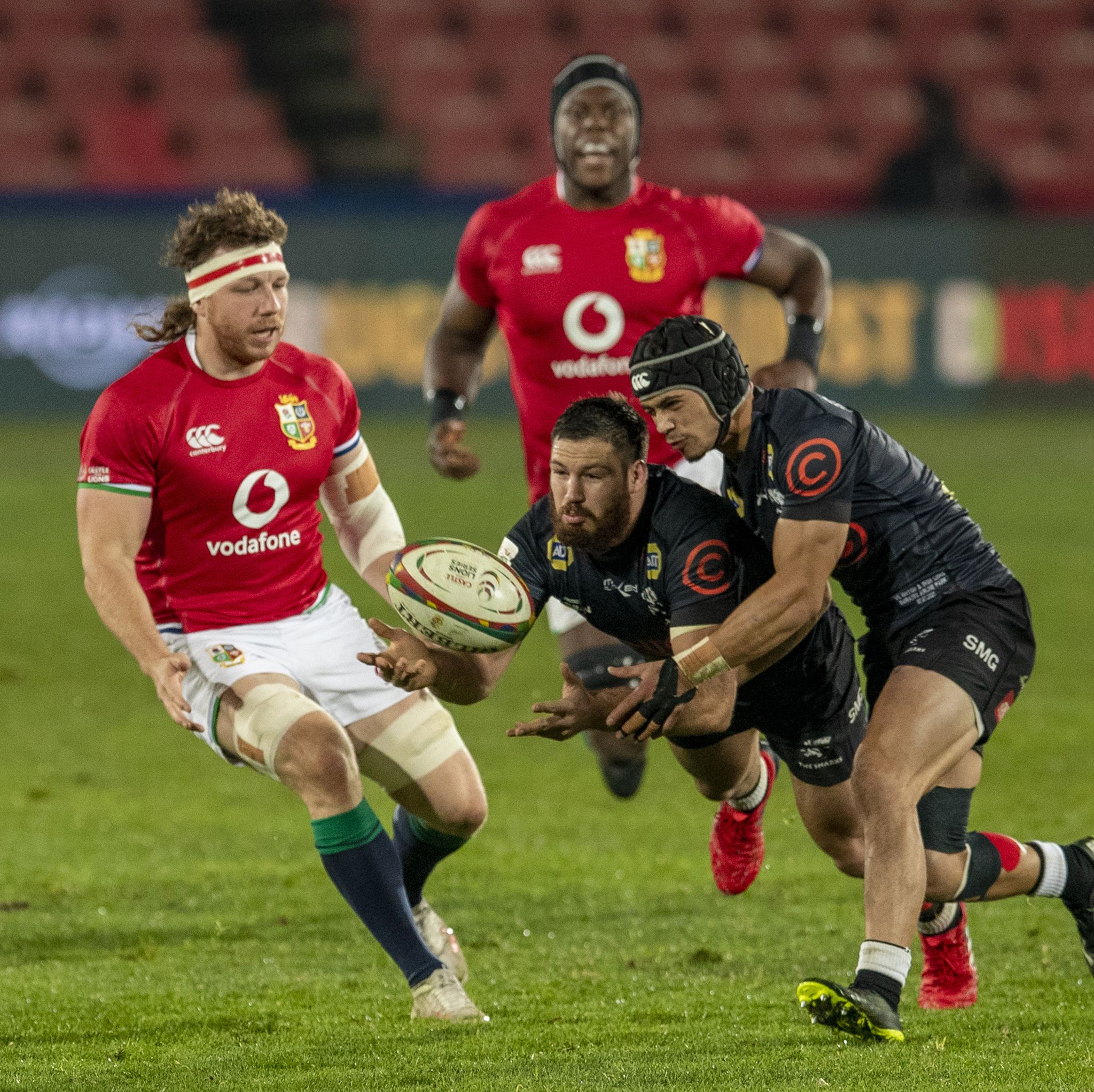 south african sharks marius louw, middle, catches the ball as british and irish lions hamish watson, left, watches on during a warm up rugby match between south africas sharks and british and irish lions at ellis park stadium in johannesburg, south africa, wednesday, july 7, 2021 ap photothemba hadebe
