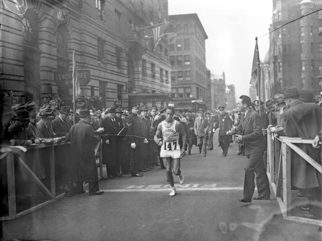 ellison brown, a 22 year old member of rhode island's narragansett tribe, breaks the tape to win the 40th annual boston marathon in 1936